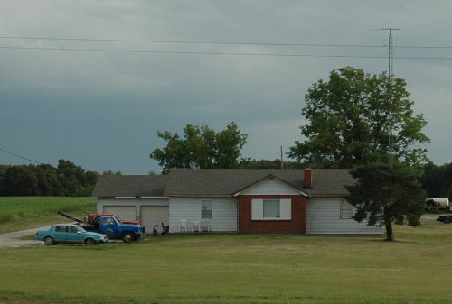 A nice house with a selection of colourful cars and trucks. Missouri (2007)