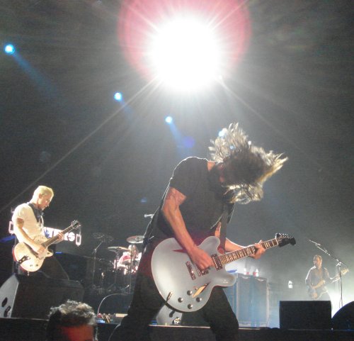 Dave thrashes the guitar at the front of the stage. Nottingham (2007)