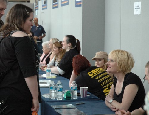 Hattie talks to a fan. Other celebrities can be seen in the background. Milton Keynes (2008)