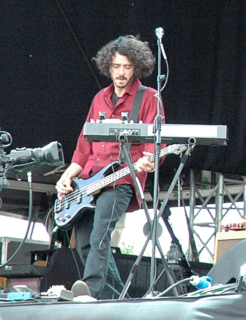 This is the bass guitar player for Guillemots, apparently his name is 'MC Lord Magro'. Manchester (2008)