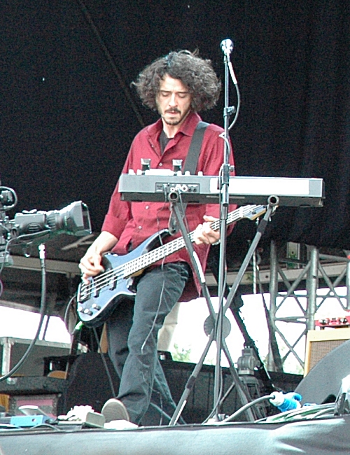 This is the bass guitar player for Guillemots, apparently his name is 'MC Lord Magrão'. Manchester (2008)