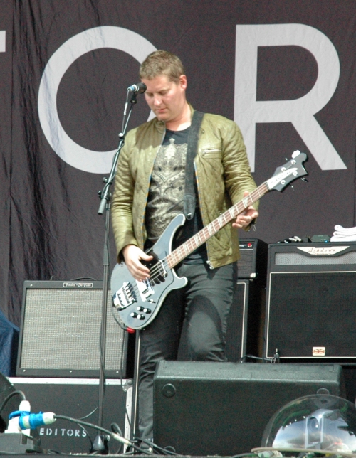 Russell Leetch playing his Bass guitar… that's what he's there for. Manchester (2008)