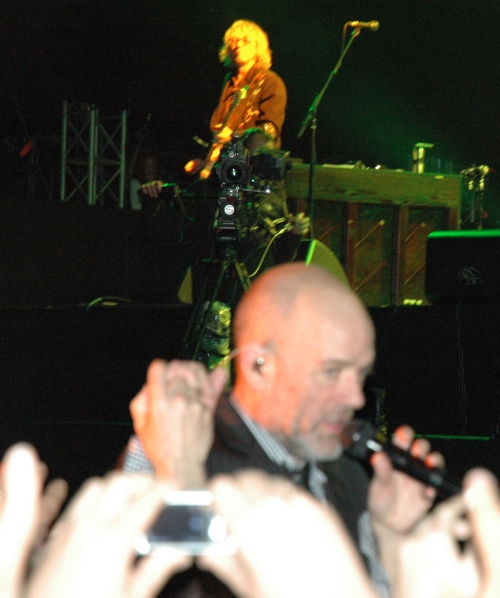 Mike Mills looks on as Michael Stipe plays with the crowd… hopefully, one day, Mike Mills will be brave enough to come down and say hello. Manchester (2008)