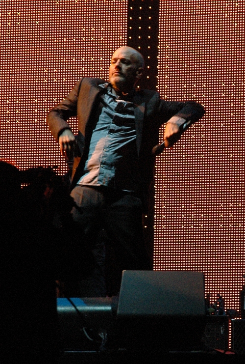 Michael Stipe re-enacts his favourite scene from 'Only fools and horses'… the scene where Del Boy falls through the bar-hatch. Manchester (2008)