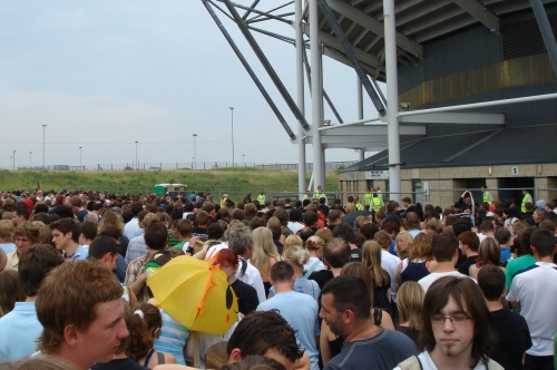 The crowd of mostly white teenagers wait for a long time to be let into the stadium, Derby (2006)