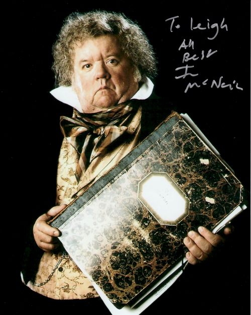 The really nice man Ian McNeice autographs a photo for me. Birmingham (2009)