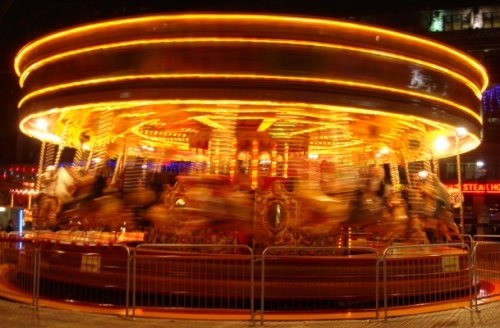 A carousel in Leicester Square going very very fast it would seem, London (2006)