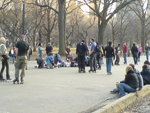 Some hippy-type people, old and young, roller skating in Central Park, New York (2006)
