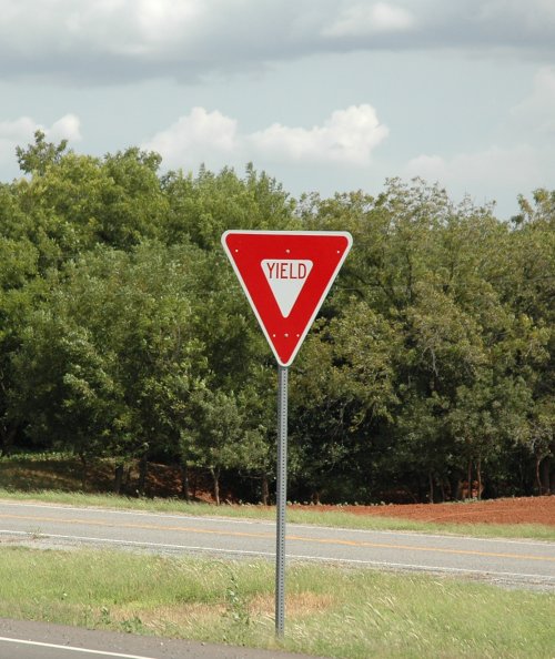 A Yield sign, the equivalent of the British 'Give way' sign. There is a sign like this on Pearl Jam's Yield album. Oklahoma (2007)